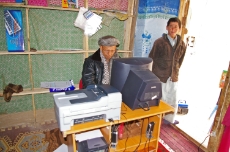 Afghanistan: Businessman from Yaftal in Northern Afghanistan offering photo and photocopying services. The electricity he uses is supplied by a micro-hydro project supported by GIZ. <br />
© GIZ / Oliver J. Haas