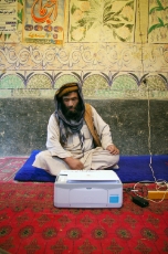 Afghanistan: Businessman from Sangab in Northern Afghanistan offering photocopying services. He is connected to a micro-hydro powered mini-grid supported by GIZ. <br />
© GIZ / Oliver J. Haas